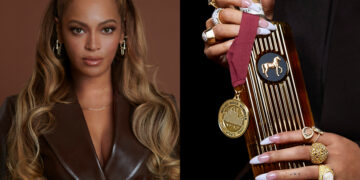 Portrait of Beyoncé on the left, looking directly at the camera with styled hair and wearing a brown satin outfit. On the right, a close-up of hands holding a SirDavis bottle and a gold medal, adorned with multiple rings.